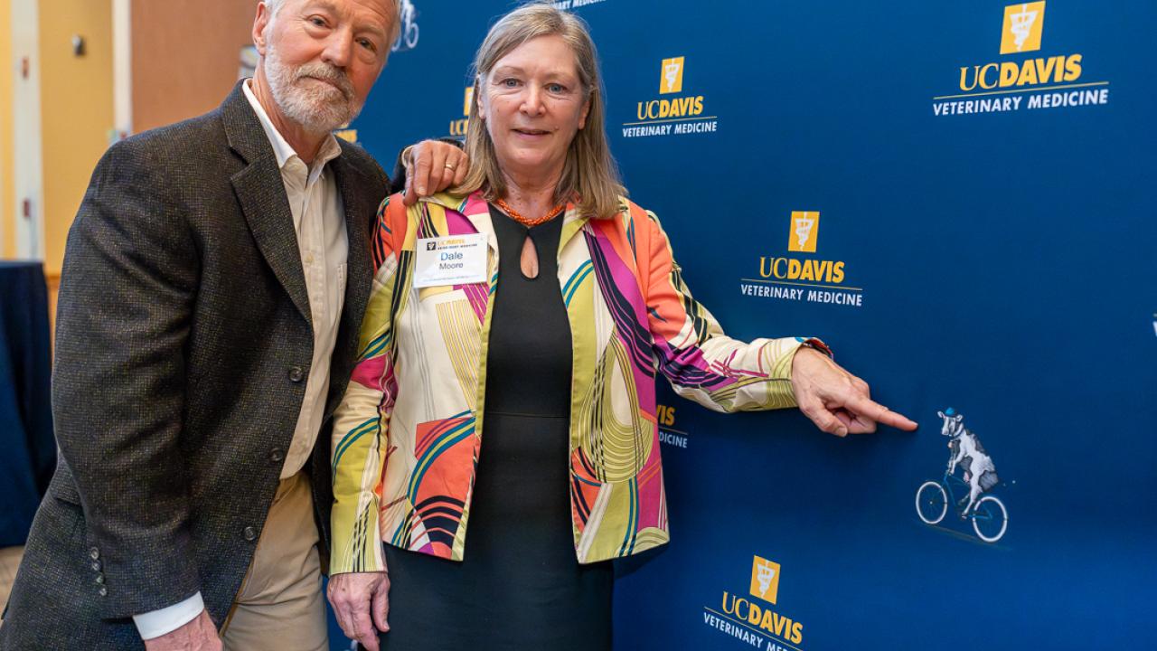 Bill Sischo and Dale Moore, photographed at the school's 2025 Evening of Gratitude. Two people standing next to a UC Davis sign.