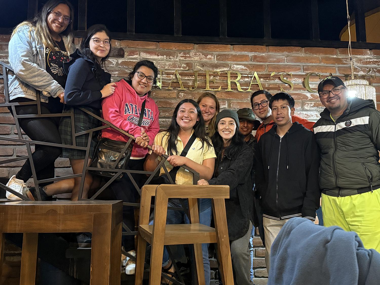 A group portrait inside a restaurant.