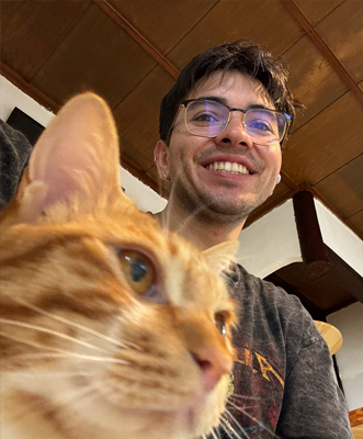 Everado Sanchez with a cat.