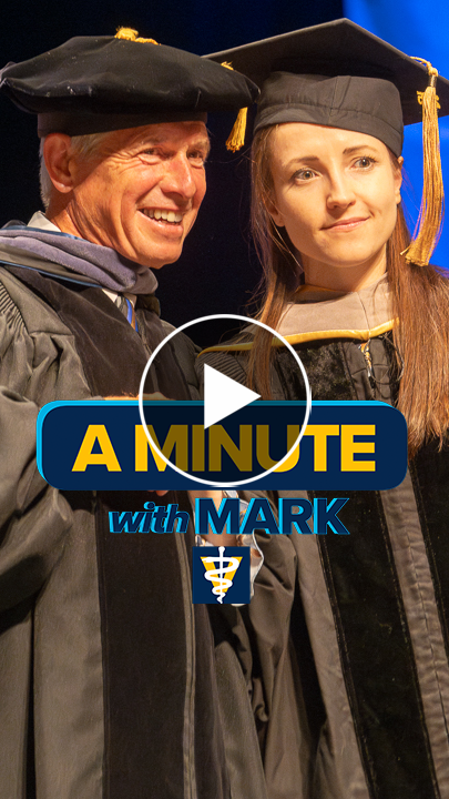 Cover of a Minute with Mark video short showing Dean Stetter and a student, both wearing a cap and gown.