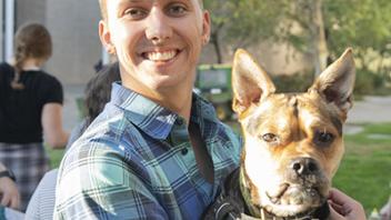 male student and dog