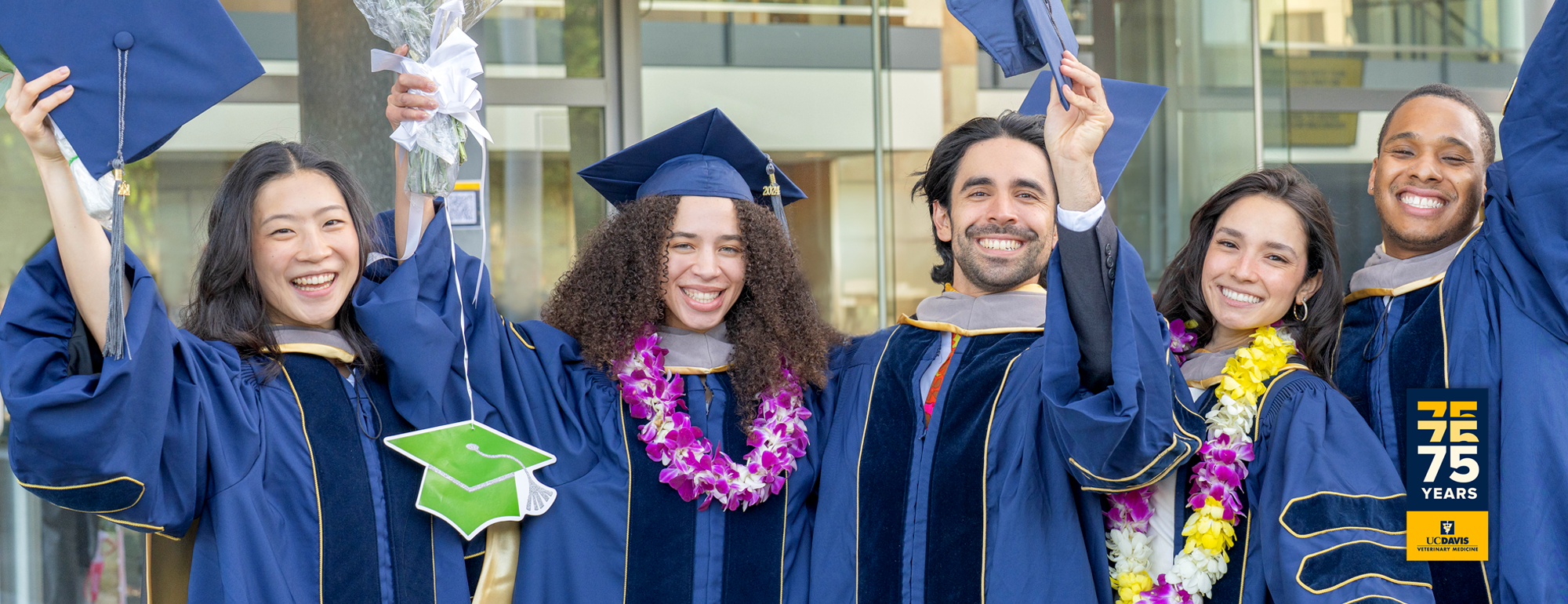 A group of students in graduation caps and gowns