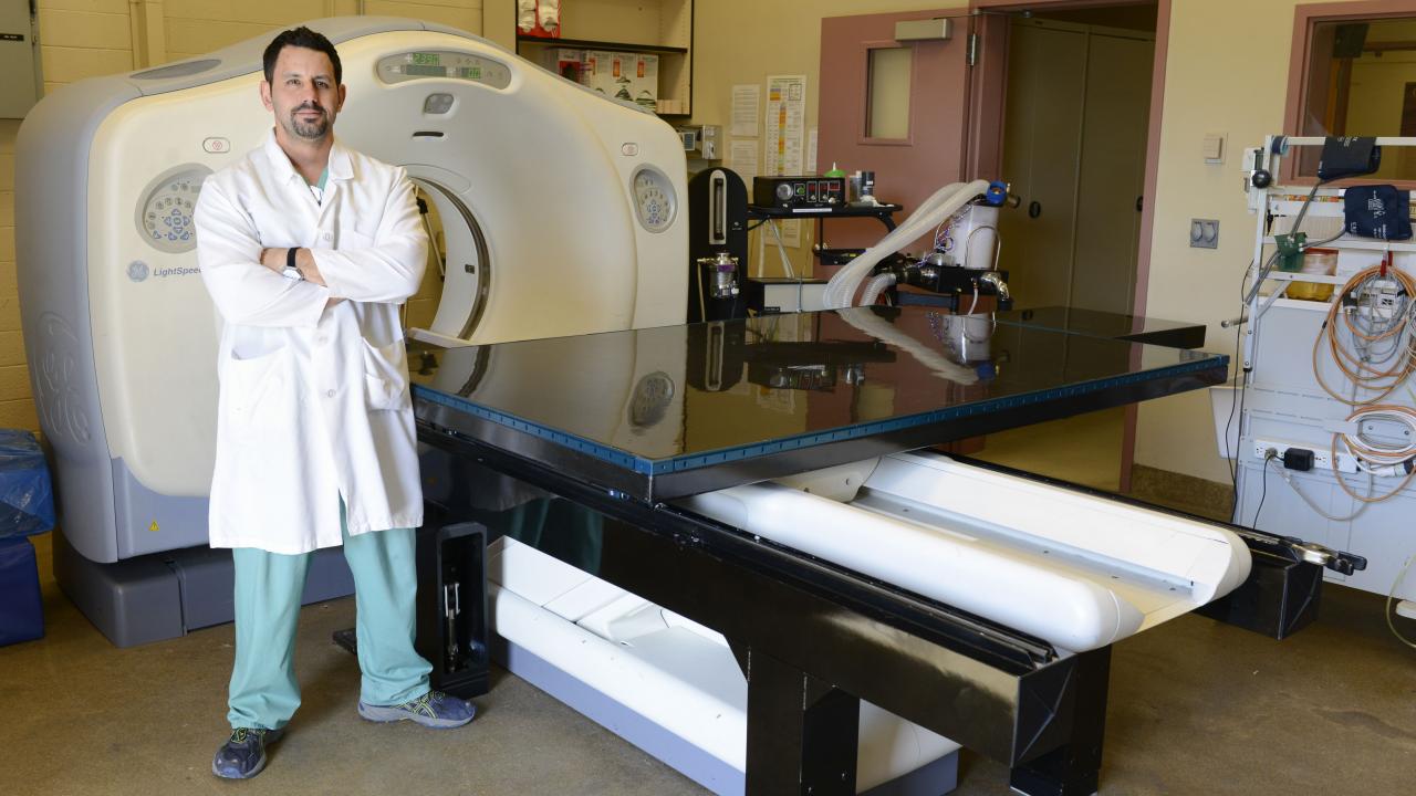 UC Davis veterinary technician Jason Peters with the carbon fiber CT table he designed for use at the UC Davis veterinary hospital.