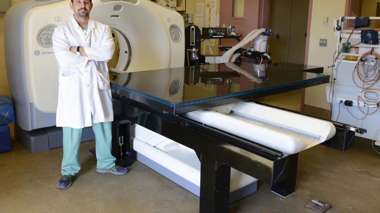 Jason Peters, RVT, RLAT, with the CT table he developed for use at the UC Davis veterinary hospital. Jason Peters, RVT, RLAT, with the CT table he developed for use at the UC Davis veterinary hospital.
