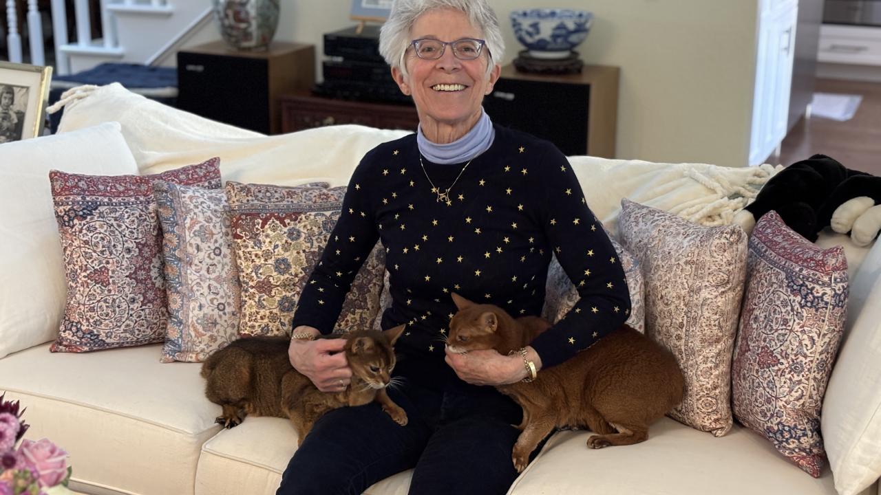 Lin Zucconi with her two cats, Itsybelle and Pinky.