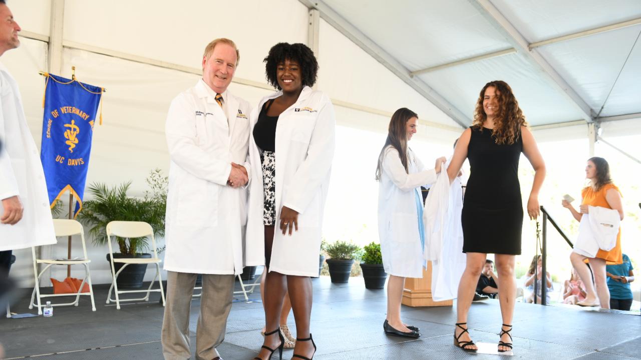 Incoming students received white coats