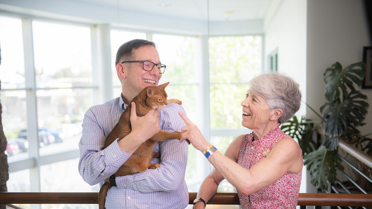 Lin Zucconi and one of her cats, Pinky, recently visited Dr. Michael Kent.