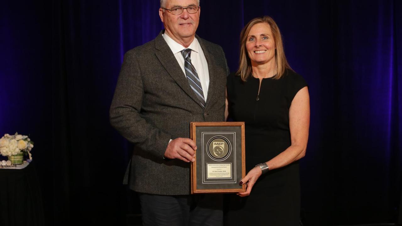 Dr. Fowler with award