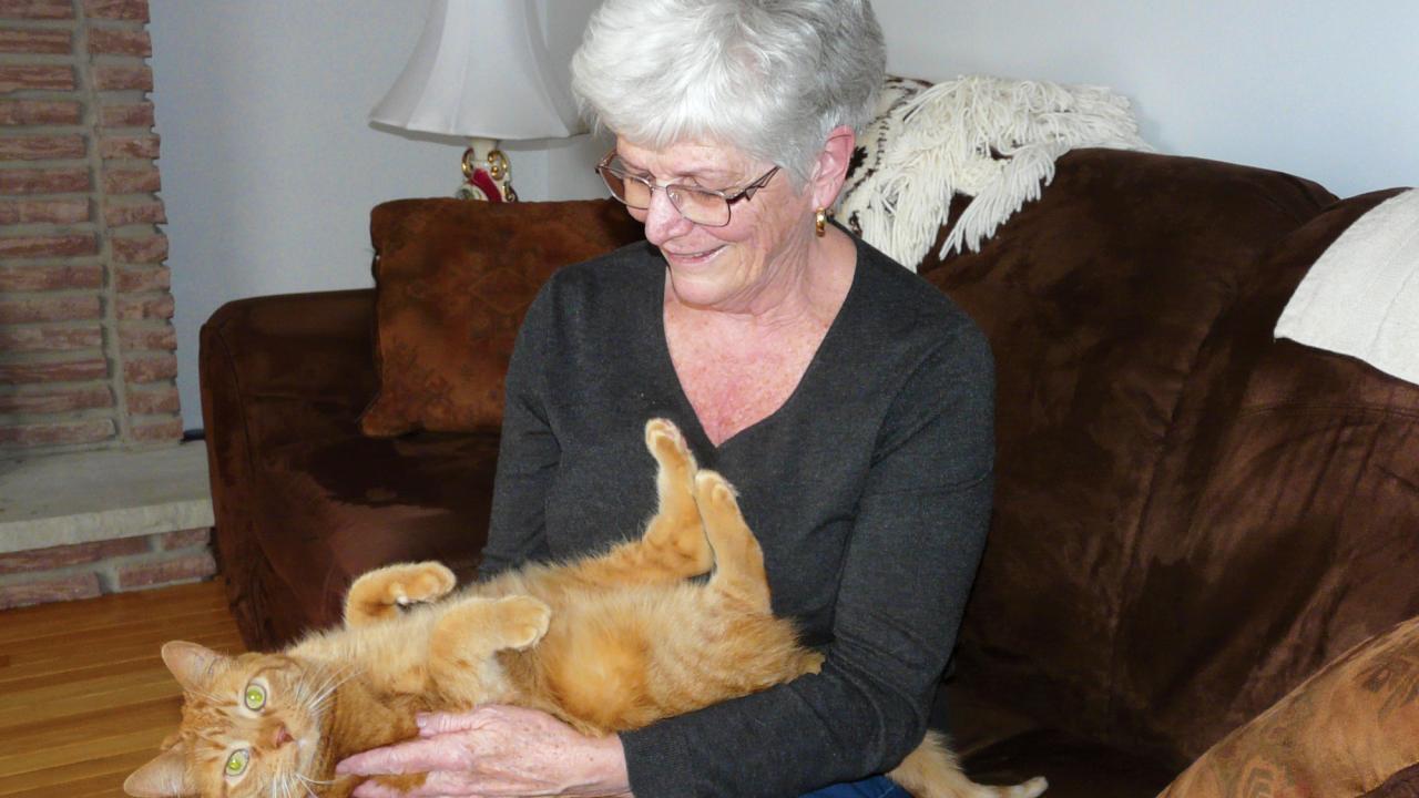 Cathy James and therapy cat, Molly.