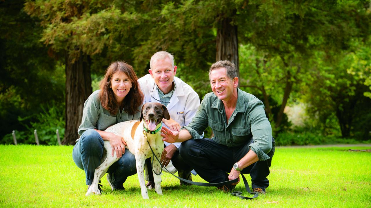 Dexter with owners Anna and Ken Zankel and Dr.  Denis Marcellin-Little