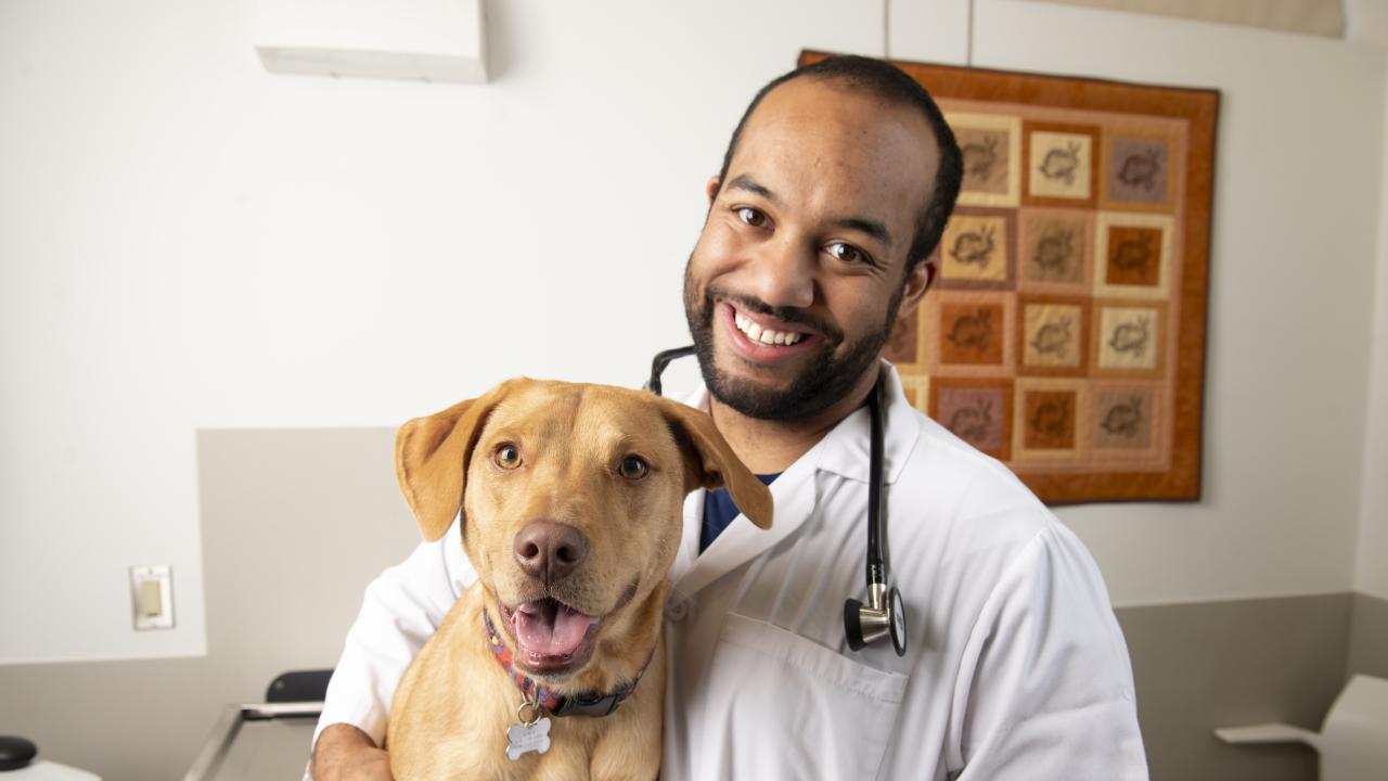 male student with dog