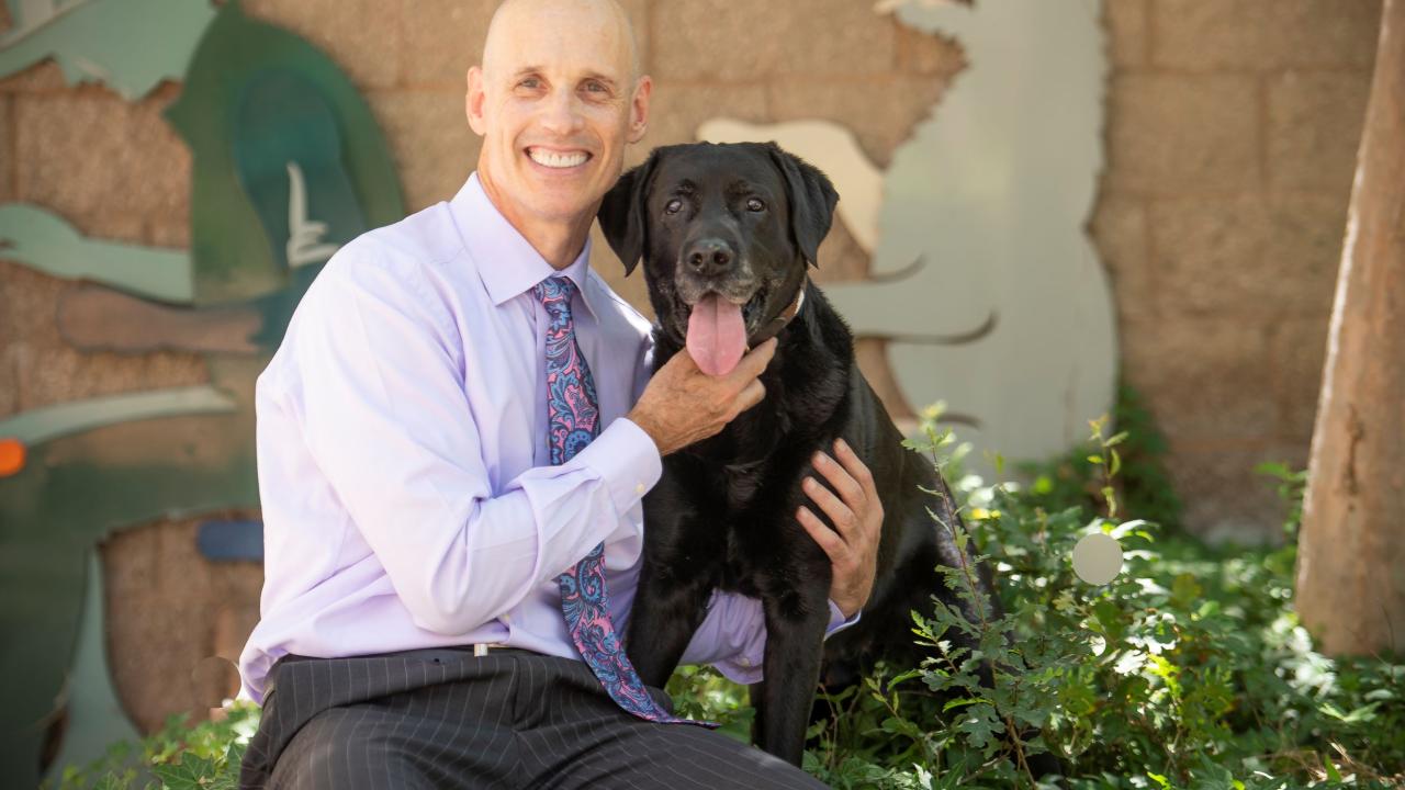 Dr. Stanley Marks, BVSc, PhD, DACVIM (Internal Medicine, Oncology, Nutrition) with his dog Tambo.