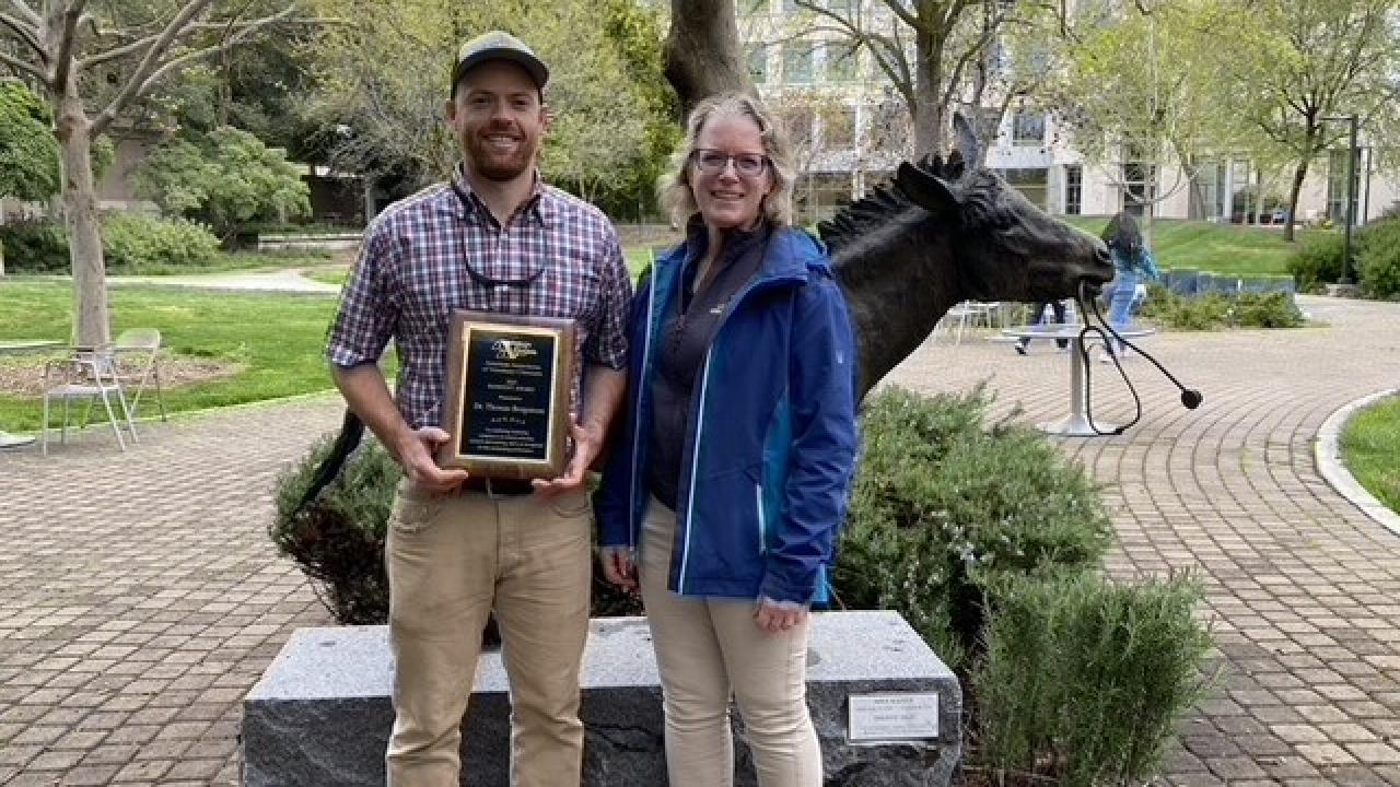 professor giving award to resident