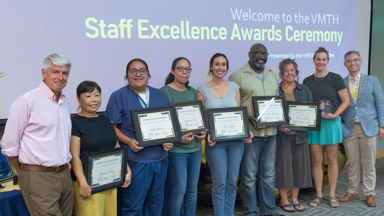group photo of award winners at ceremony