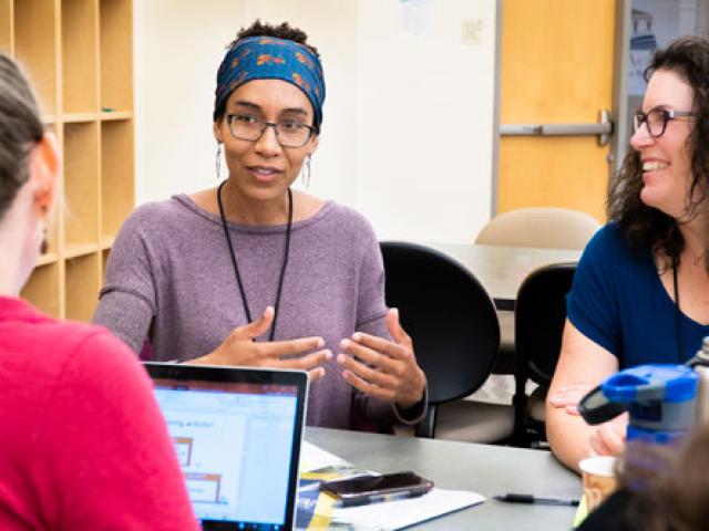 Faculty discussing 