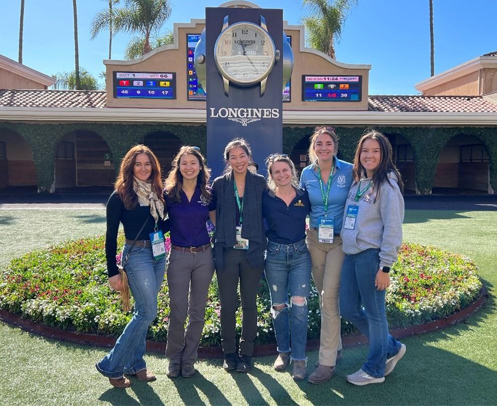 group of six female veterinary students at race track