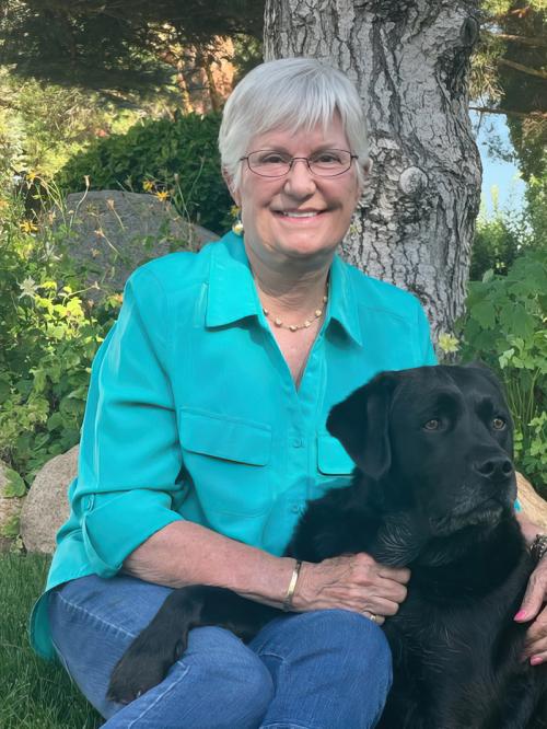 Barbi McCoy and her loyal canine companion, Bear.