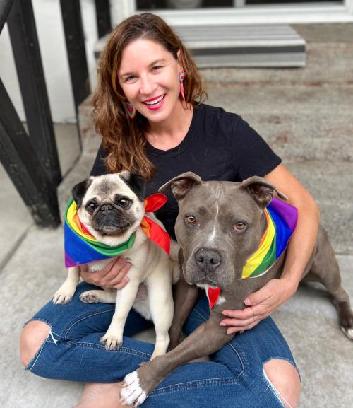 Dani with dogs for pride month