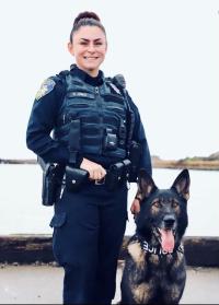 police officer standing with K9 officer dog