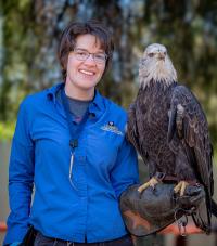 woman holding bald eagle