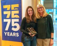 Dr. Heather Knych (left) receives her award from Dr. Joie Watson