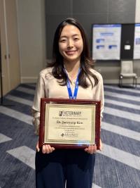 veterinarian holding award