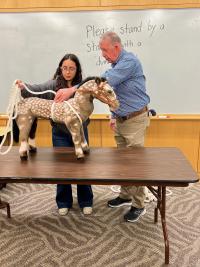 veterinarian teaching technique to participant
