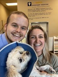 dog and owners happy at discharge from the UC Davis veterinary hospital