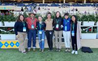 group of seven veterinarians and students at race track