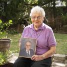 Annette Parker holds a photo of her late husband, Dr. Harold Parker '52.