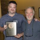 Dr. Peter Havel (right) receives his award from Dr. Kevin Woolard.