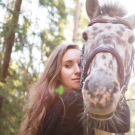 woman hugging a horse, image from modern equine vet magazine