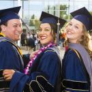 three students at commencement 2019