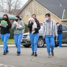 UC Davis veterinary students walking with animals