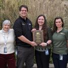 group of veterinarians presenting an award