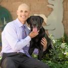 Dr. Stanley Marks, BVSc, PhD, DACVIM (Internal Medicine, Oncology, Nutrition) with his dog Tambo.