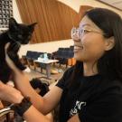 woman holding kitten